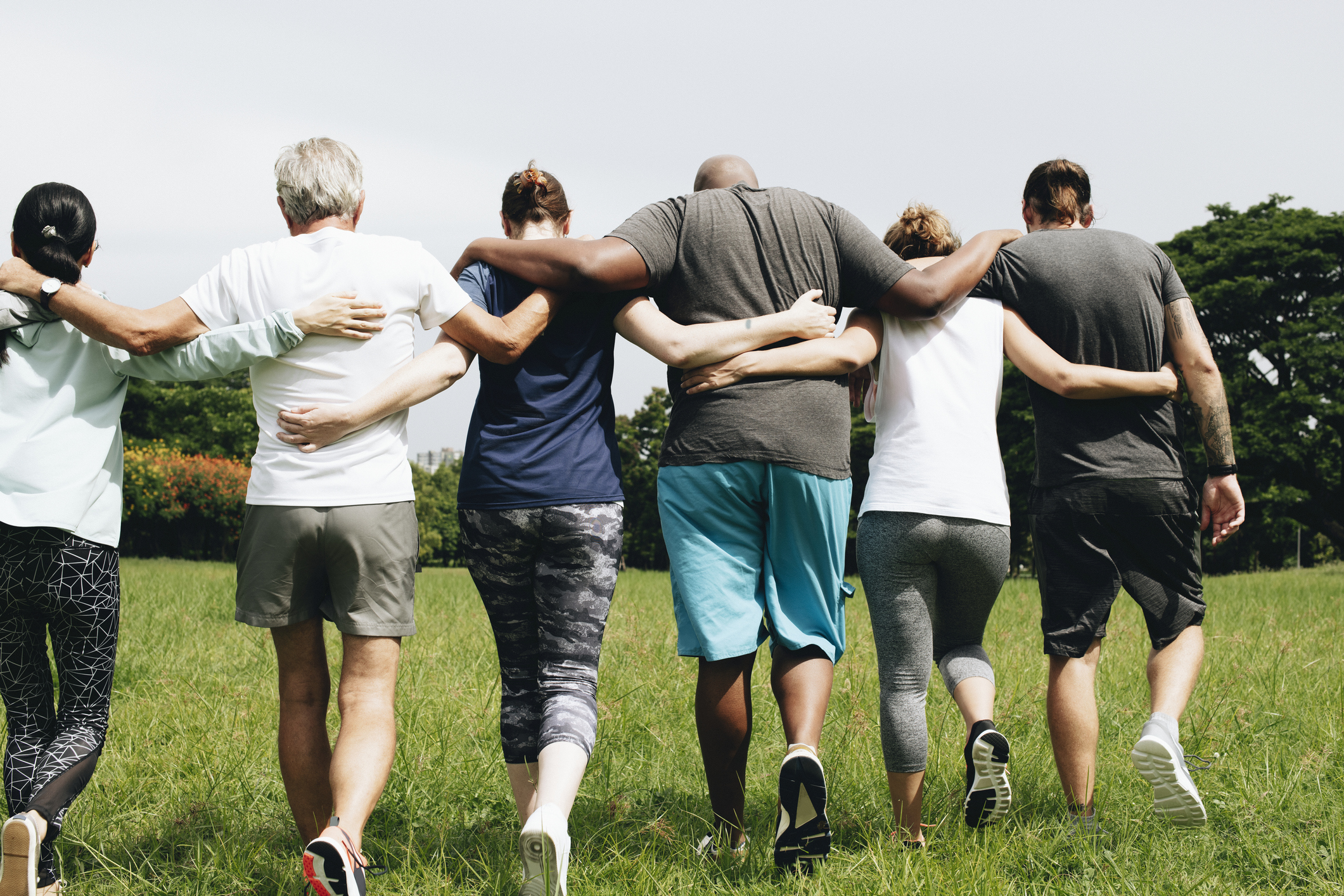 Group of people hugging in the park